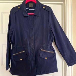 Navy blue, water-resistant tailored raincoat.